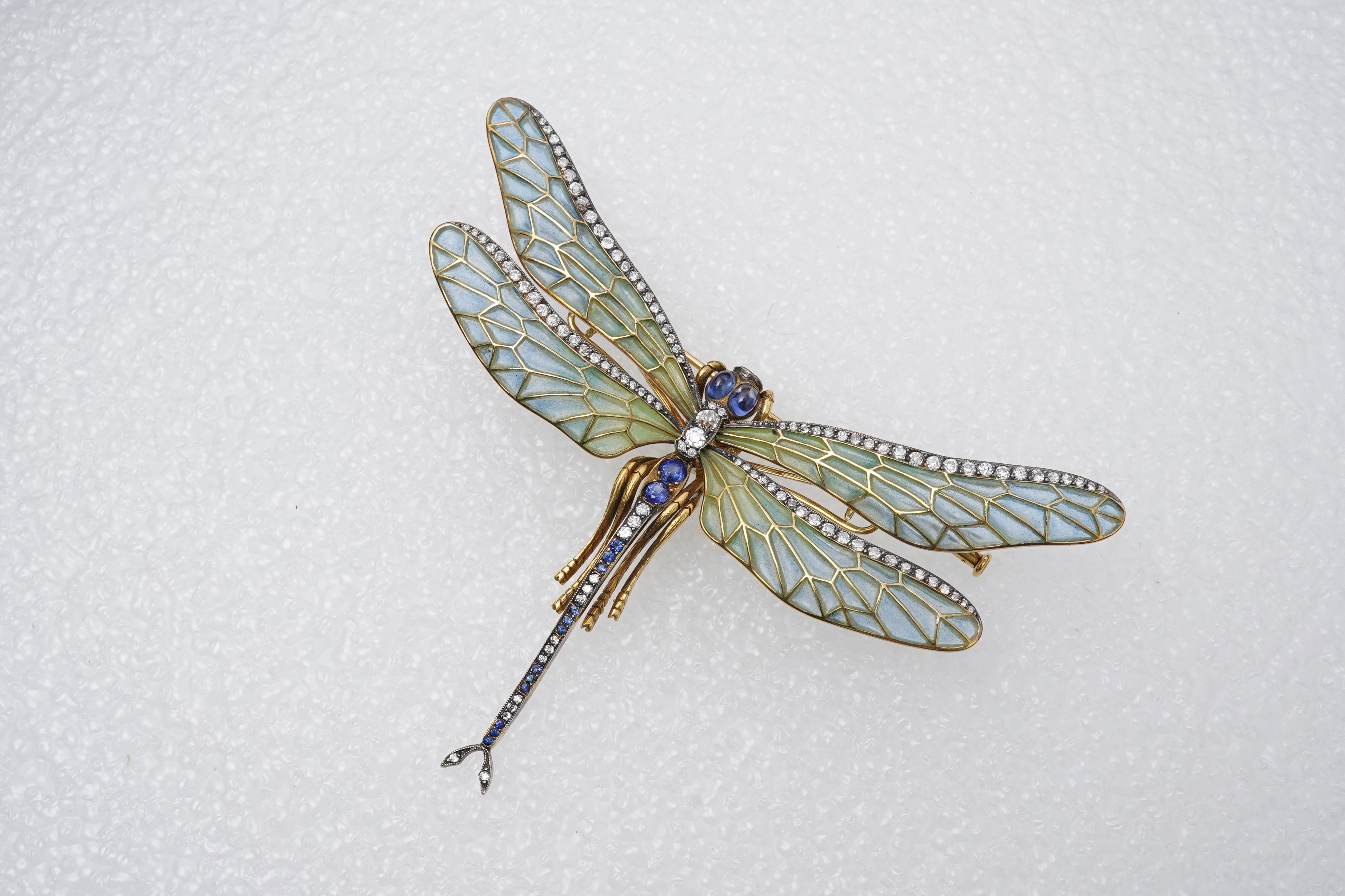 An enamel, sapphire and diamond dragonfly brooch